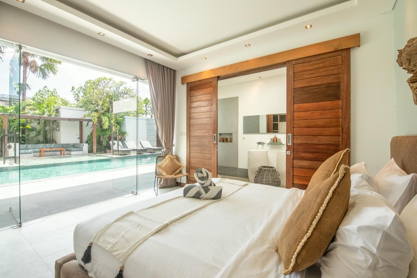 Villa Niko Dua — bedroom overlooking the pool terrace