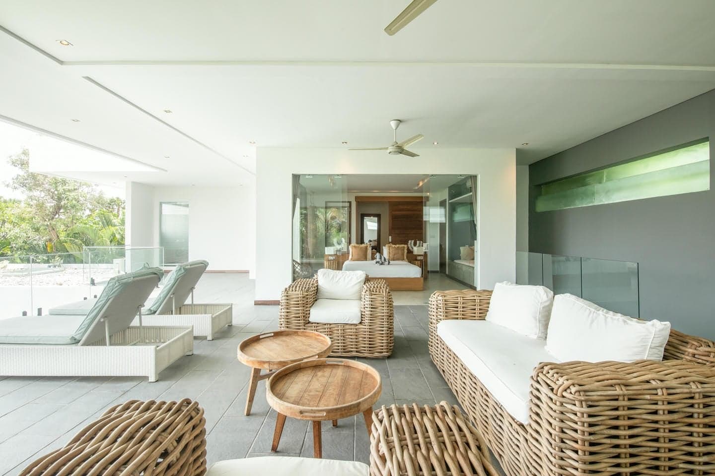 Villa Niko Dua — upper-floor lounge with rattan seating